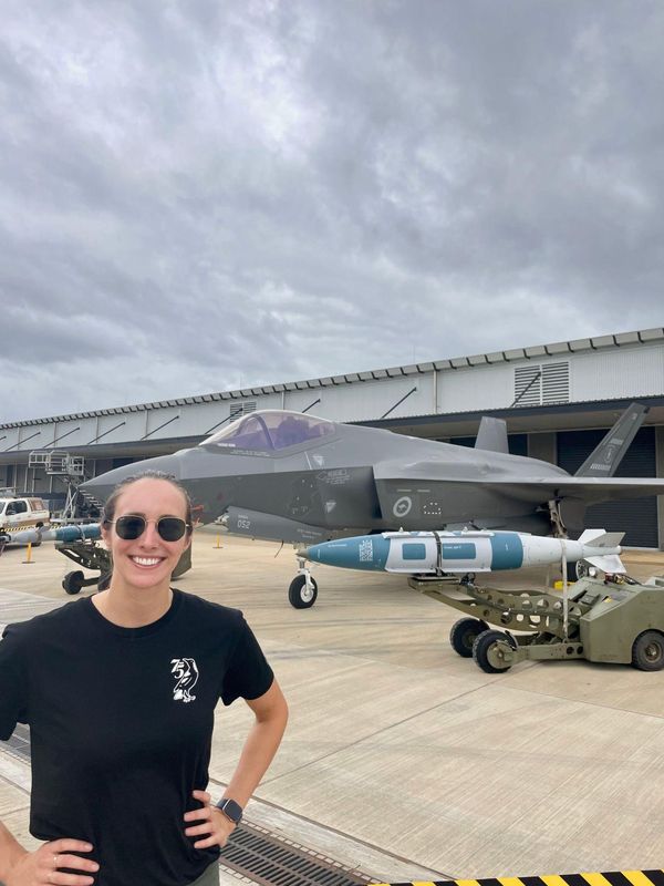 Leanne Wright at a RAAF base beside an F-35