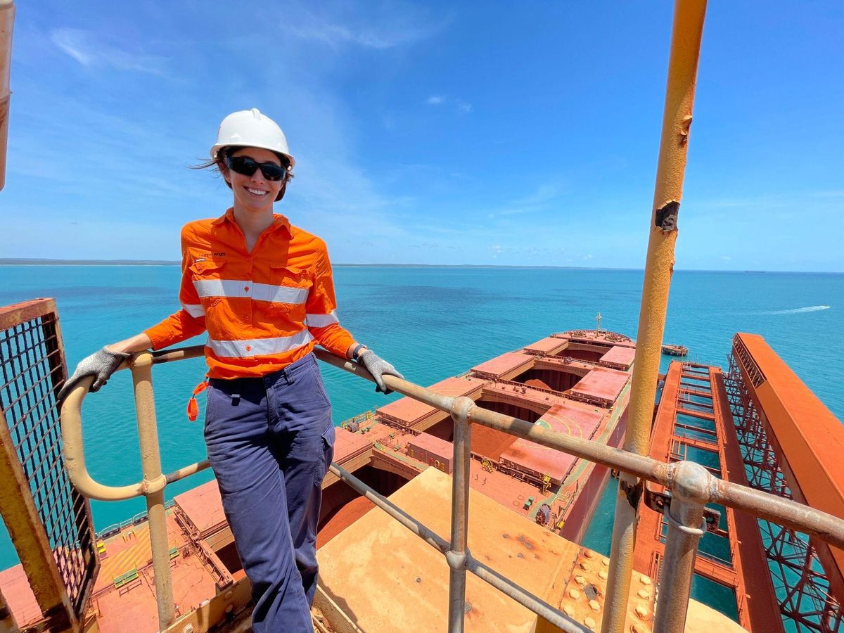 Leanne Wright in hi vis and hard hat on the deck of a bulk carrier