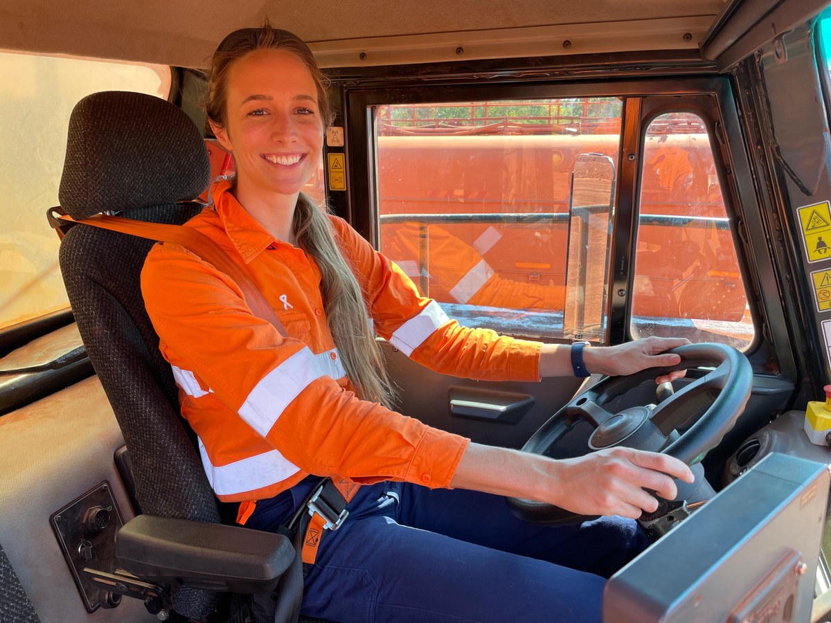 Leanne Wright seated in a haul truck cab assessing the operator workstation