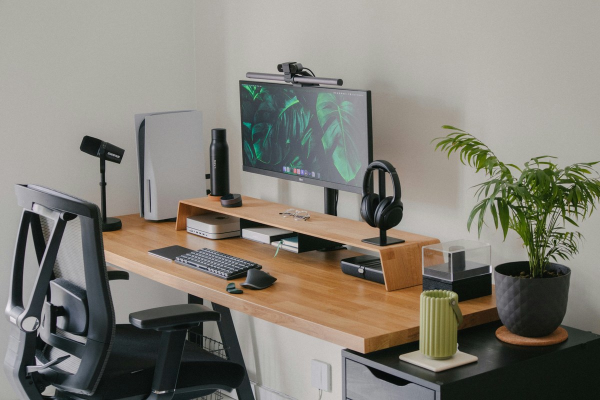 Desk set up with monitor at eye height and an ergonomic chair